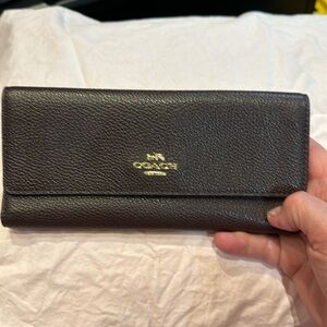 Boysenberry colored trifold wallet